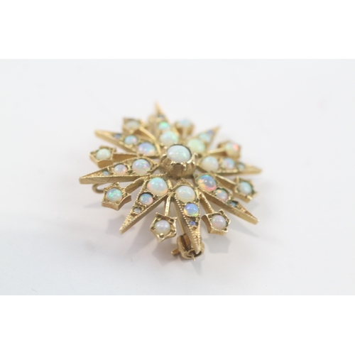 99 - 9ct gold opal star brooch (4.3g)