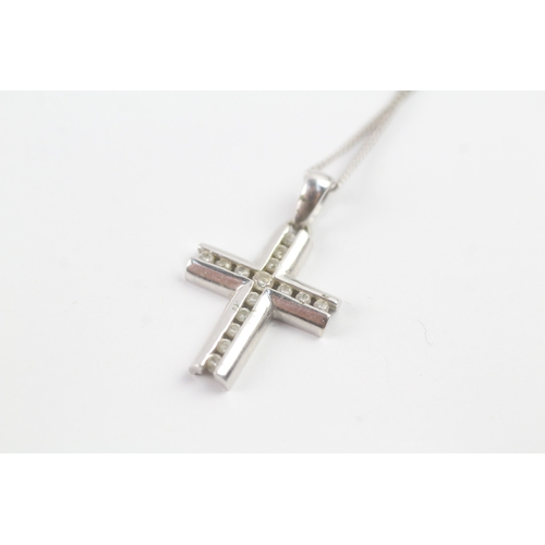 117 - 9ct white gold diamond cross pendant on chain (1.9g)