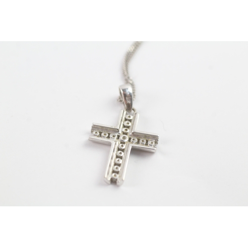 117 - 9ct white gold diamond cross pendant on chain (1.9g)