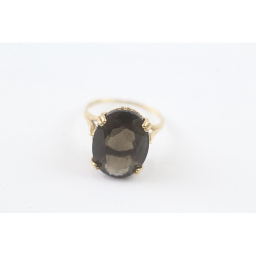 119 - 9ct gold smoky quartz cocktail ring (3.1g) Size K 1/2