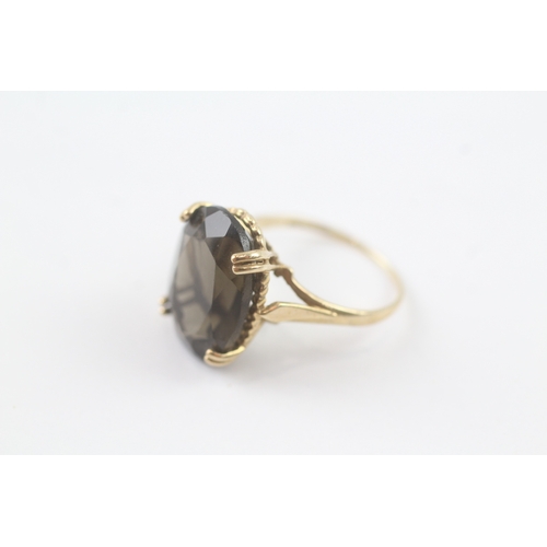 119 - 9ct gold smoky quartz cocktail ring (3.1g) Size K 1/2