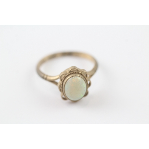 125 - 9ct gold opal dress ring (2.6g)