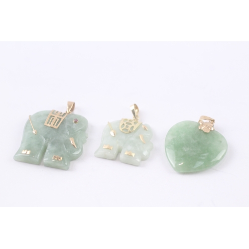 132 - 3 x 9ct gold carved jade pendants (16g)