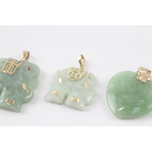 132 - 3 x 9ct gold carved jade pendants (16g)