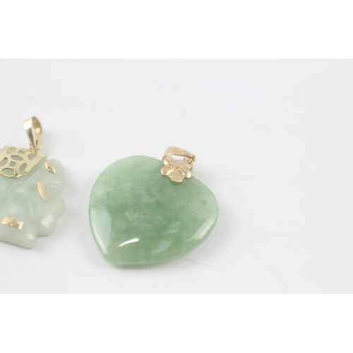 132 - 3 x 9ct gold carved jade pendants (16g)