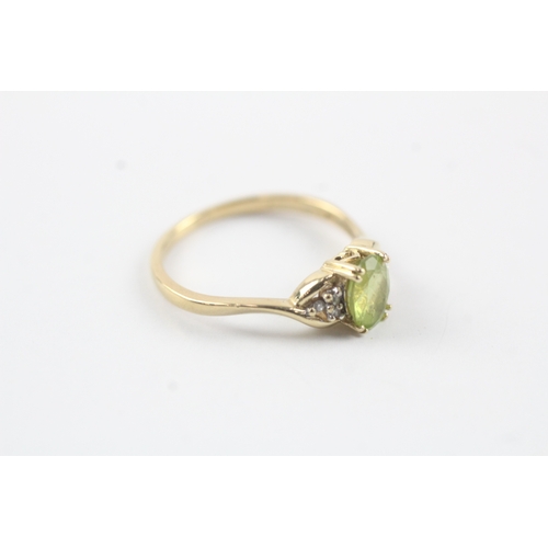 145 - 9ct gold diamond & peridot cluster ring (1.9g) Size O