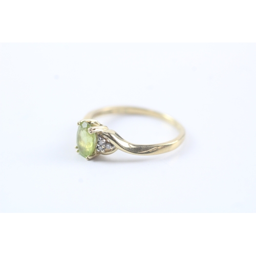 145 - 9ct gold diamond & peridot cluster ring (1.9g) Size O