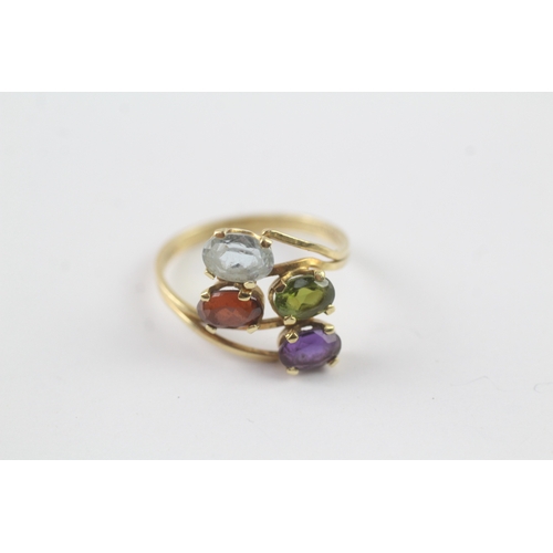 179 - 18ct gold multi gemstone cocktail ring inc. garnet and topaz (2.6g) - as seen - misshapen Size M