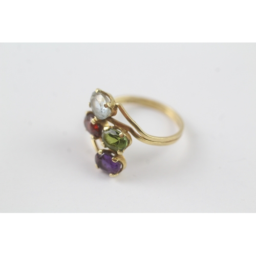 179 - 18ct gold multi gemstone cocktail ring inc. garnet and topaz (2.6g) - as seen - misshapen Size M