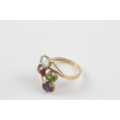 179 - 18ct gold multi gemstone cocktail ring inc. garnet and topaz (2.6g) - as seen - misshapen Size M