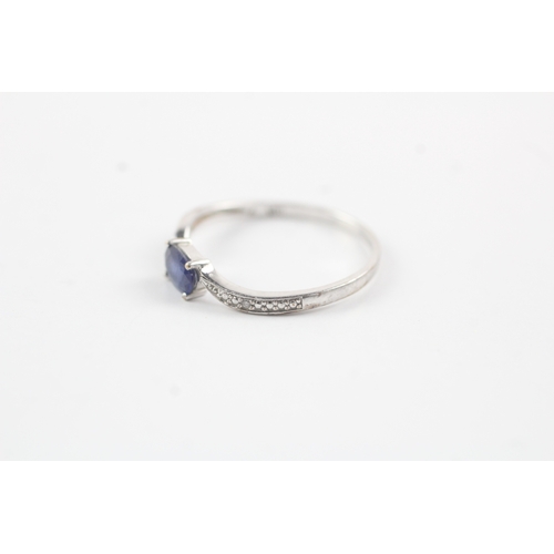 195 - 9ct white gold diamond & sapphire bypass ring (1.2g) Size P