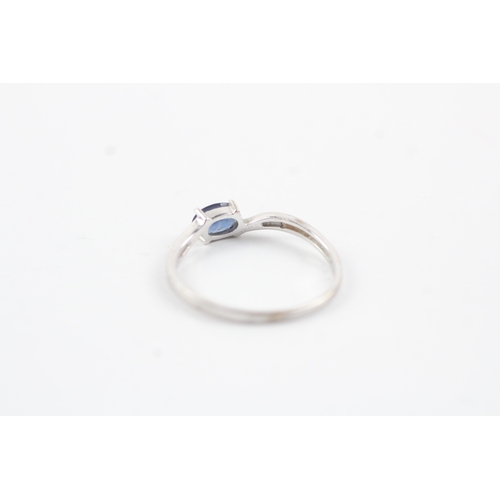 195 - 9ct white gold diamond & sapphire bypass ring (1.2g) Size P