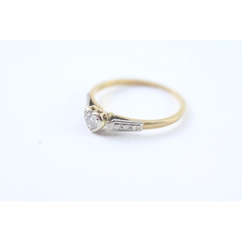 201 - 18ct gold diamond solitaire dress ring w/ diamond set shoulders (1.7g) Size N