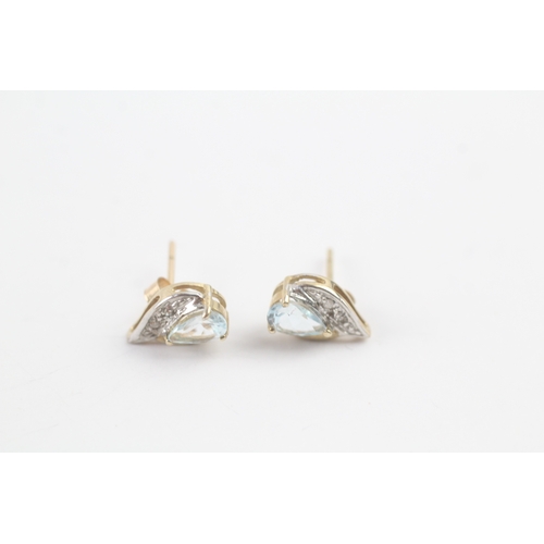 209 - 9ct gold diamond and blue gemstone twist earrings (1.3g)