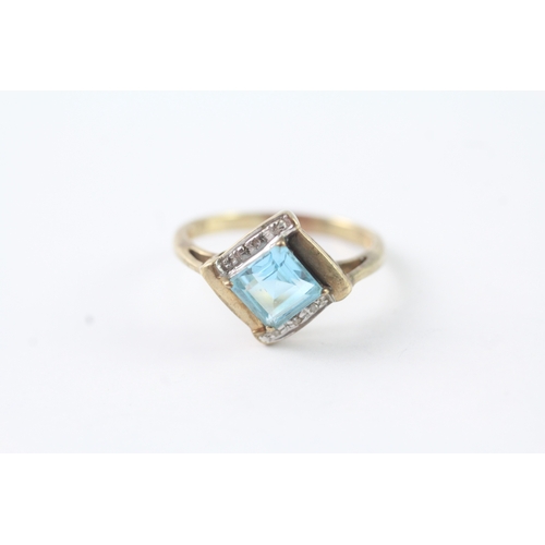 215 - 9ct gold blue topaz & diamond dress ring (2.4g) Size N