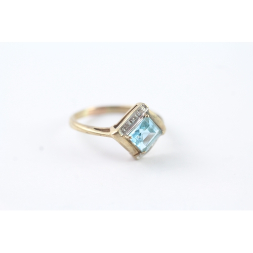 215 - 9ct gold blue topaz & diamond dress ring (2.4g) Size N