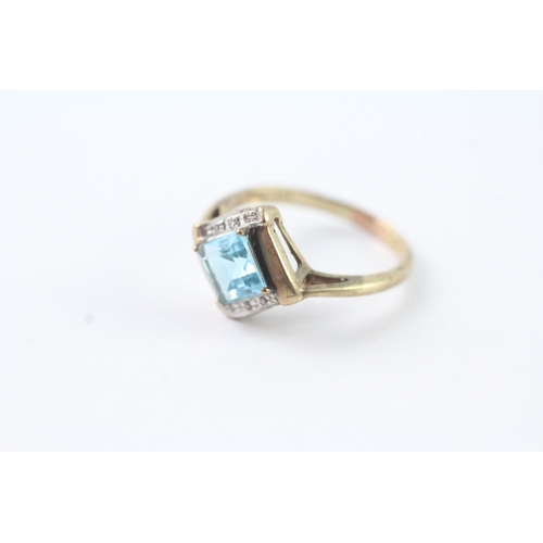 215 - 9ct gold blue topaz & diamond dress ring (2.4g) Size N