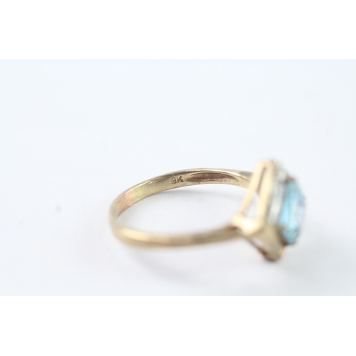 215 - 9ct gold blue topaz & diamond dress ring (2.4g) Size N