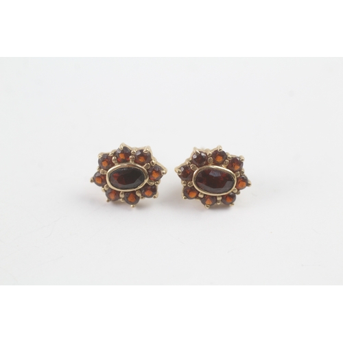 216 - 9ct gold garnet halo stud earrings (1.8g)