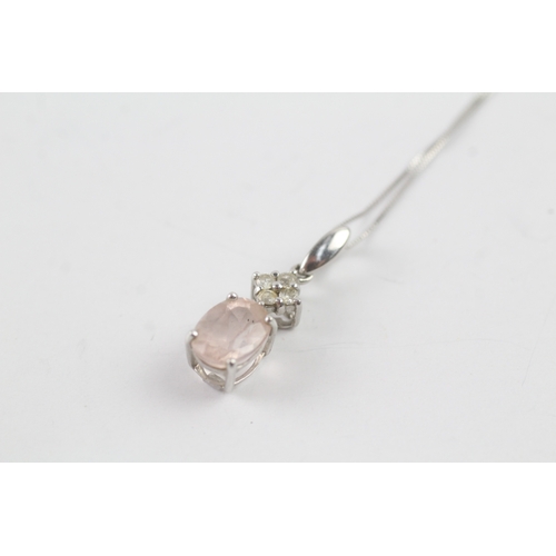 234 - 9ct white gold diamond and pink gemstone pendant on chain (1.7g)