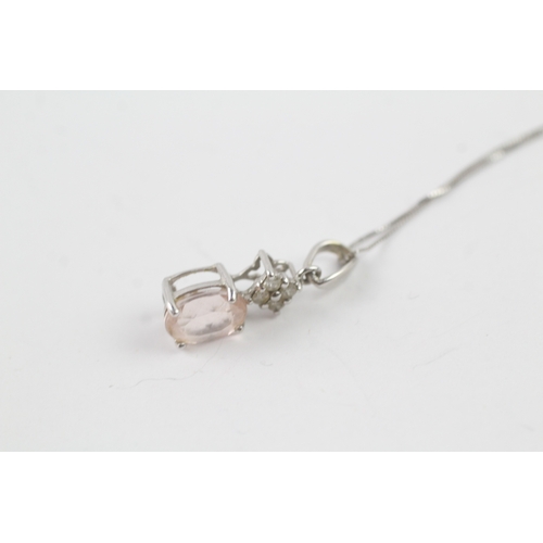 234 - 9ct white gold diamond and pink gemstone pendant on chain (1.7g)