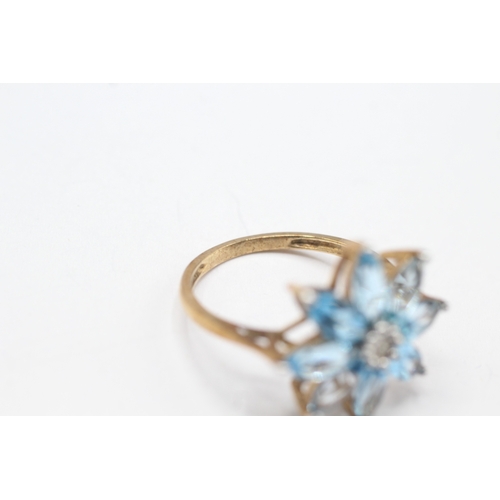 241 - 9ct gold diamond & blue gemstone flower ring (3.1g) Size P