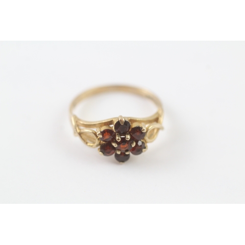 29 - 9ct gold garnet cluster ring with decorative shoulder detail (2.2g) Size L 1/2