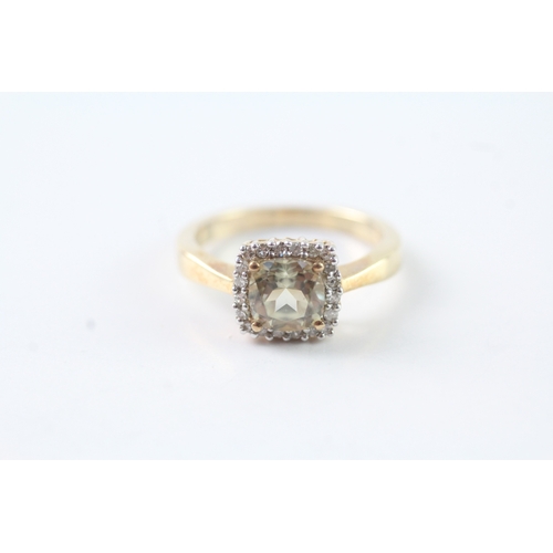 31 - 9ct gold green gemstone and diamond halo ring (2.9g) Size K 1/2