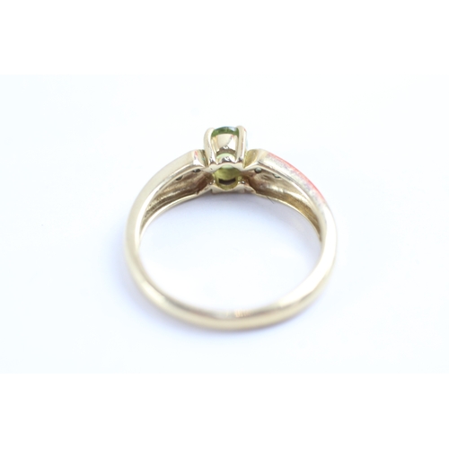 57 - 9ct gold peridot & diamond dress ring (2.8g) Size N