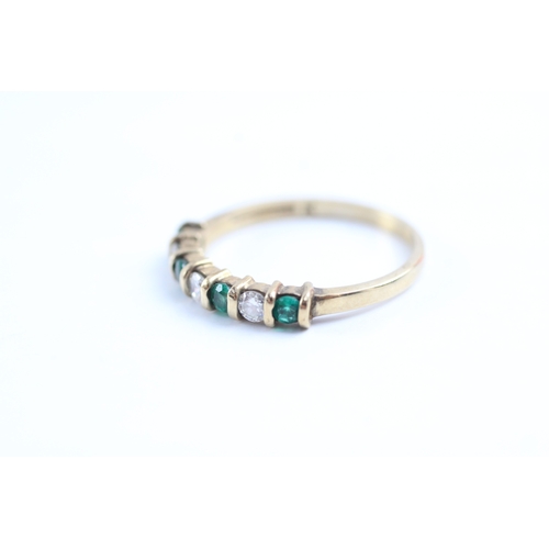 61 - 9ct gold emerald and diamond half eternity ring (1.9g) Size P 1/2