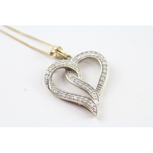 80 - 9ct gold diamond heart pendant on chain (2.6g) Size J