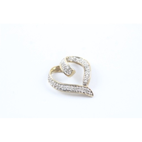 87 - 9ct gold diamond love heart pendant (2.2g)