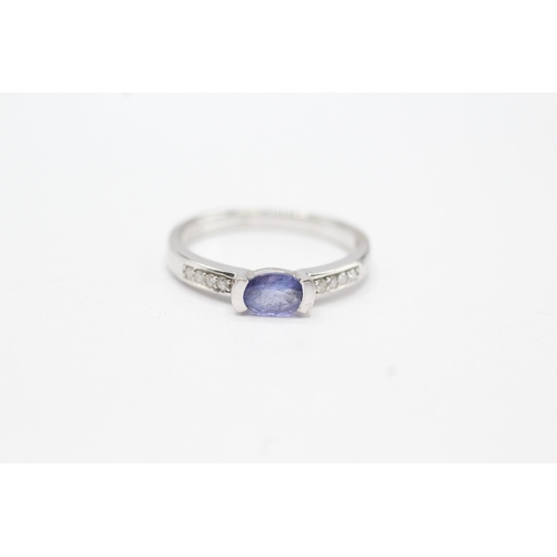 13 - 9ct gold oval cut tanzanite & diamond ring (1.9g) Size M 1/2