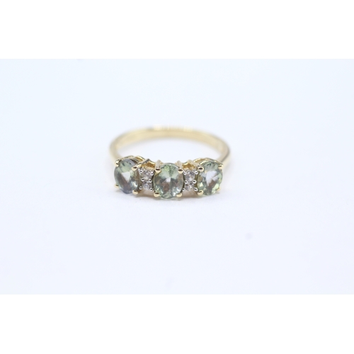 19 - 9ct gold green & clear gemstone dress ring (1.9g) Size L 1/2