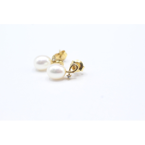 54 - 9ct gold diamond & pearl drop earrings (2.3g)