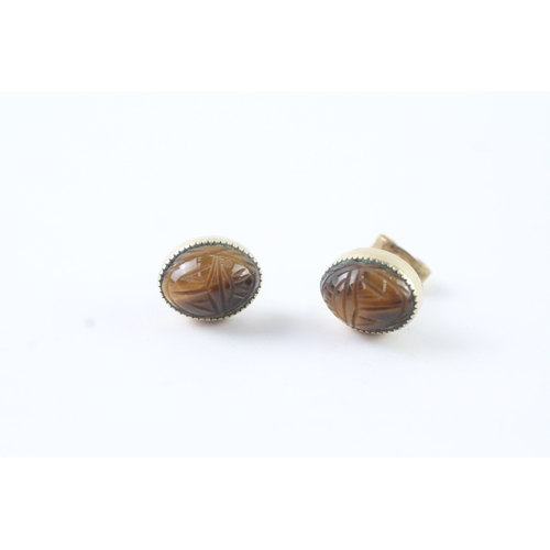 59 - 9ct gold carved tiger-eye stud earrings (2.2g)