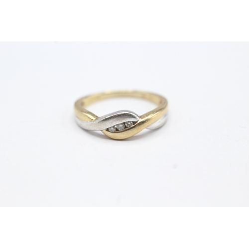 77 - 9ct gold diamond by pass ring (2.8g) Size O