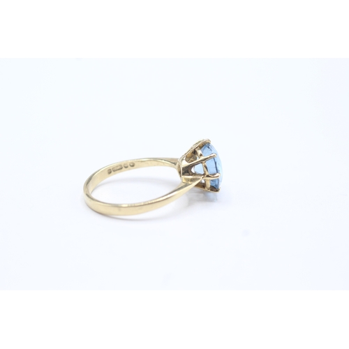 79 - 9ct gold blue gemstone solitaire ring (2.9g)