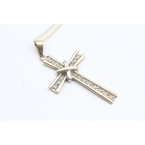 87 - 9ct gold diamond cross pendant necklace (3g)