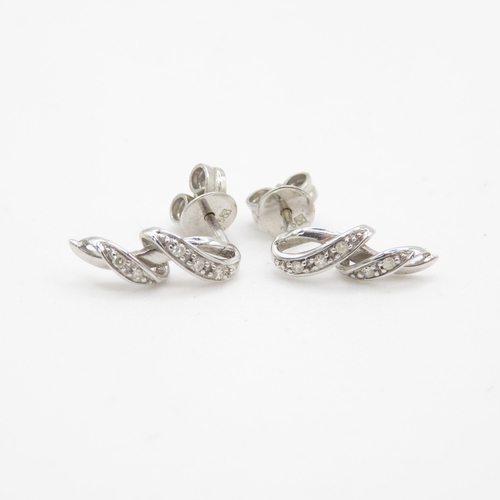 121 - 9ct white gold diamond drop earrings (1.3g)