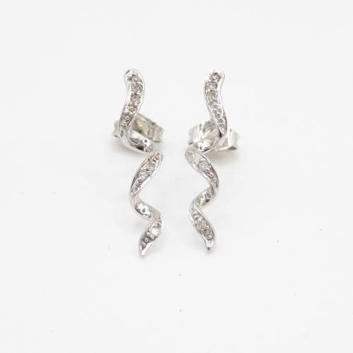 128 - 9ct white gold twisted diamond stud earrings (1.1g)