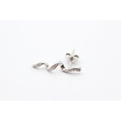 128 - 9ct white gold twisted diamond stud earrings (1.1g)