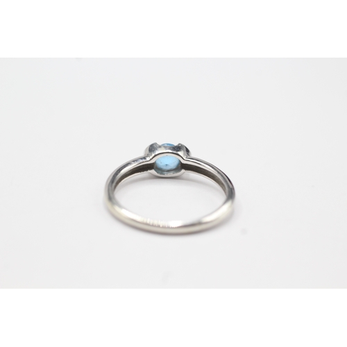 129 - 9ct white gold blue gemstone solitaire ring (2.2g) Size O