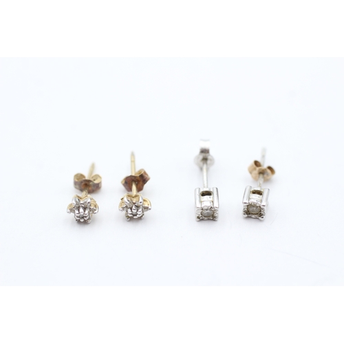 206 - 9ct gold x2 diamond stud earrings set (1.3g)