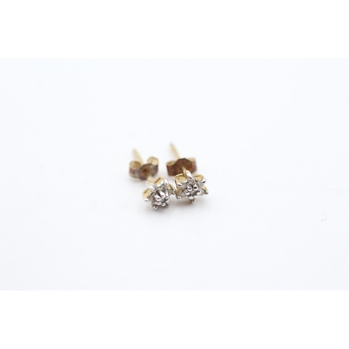 206 - 9ct gold x2 diamond stud earrings set (1.3g)