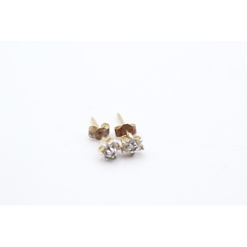 206 - 9ct gold x2 diamond stud earrings set (1.3g)