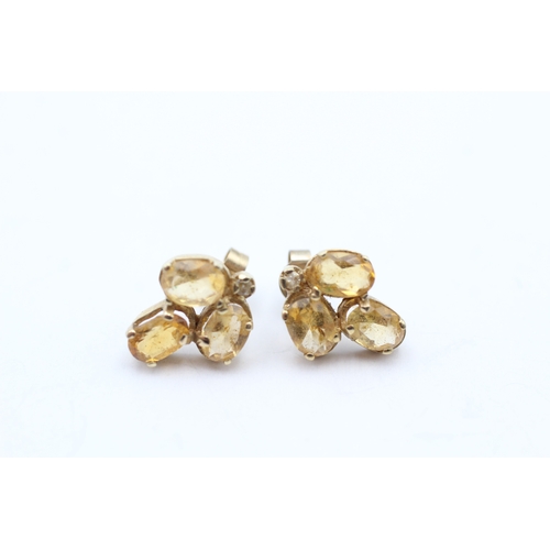 212 - 9ct gold oval cut citrine trilogy earrings (2.1g)