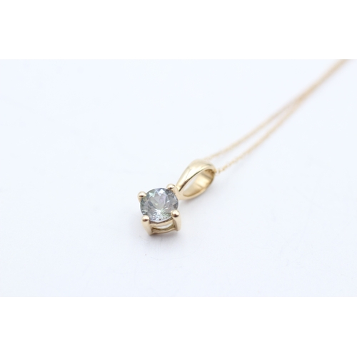 33 - 9ct gold blue gemstone pendant necklace (0.9g)