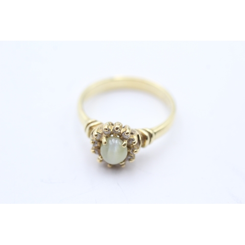 51 - 9ct gold cats eye chrysoberyl & diamond cluster ring (4.6g) Size O