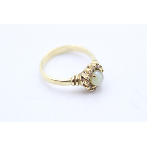 51 - 9ct gold cats eye chrysoberyl & diamond cluster ring (4.6g) Size O